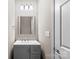Well-lit half bathroom with a modern vanity and mirror at 1033 12Th Avenue Nw Dr, Hickory, NC 28601