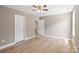 Bright bedroom features a ceiling fan and two bright-white doors at 1033 12Th Avenue Nw Dr, Hickory, NC 28601