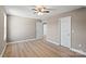 Spacious bedroom with hardwood floors, neutral paint, and bright white doors at 1033 12Th Avenue Nw Dr, Hickory, NC 28601