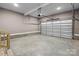 Spacious garage with concrete flooring, an automatic door, and ample room for storage at 1033 12Th Avenue Nw Dr, Hickory, NC 28601