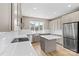 Modern kitchen with stainless steel appliances, a central island, and bright lighting at 1033 12Th Avenue Nw Dr, Hickory, NC 28601