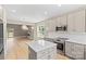 Bright open kitchen with stainless appliances, white countertops, and seamless flow to dining at 1033 12Th Avenue Nw Dr, Hickory, NC 28601