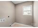 Cozy laundry room with natural light, modern outlets, and compact design at 1033 12Th Avenue Nw Dr, Hickory, NC 28601