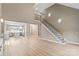 Spacious living area featuring a modern fireplace, high ceilings, and staircase to upper floor at 1033 12Th Avenue Nw Dr, Hickory, NC 28601