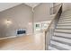 Spacious living area featuring a modern fireplace, high ceilings, and staircase to upper floor at 1033 12Th Avenue Nw Dr, Hickory, NC 28601