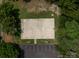 Aerial view of outdoor basketball court in a wooded area, parking nearby at 1115 Berry Ridge Rd, Charlotte, NC 28270