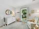 Bedroom featuring a dresser, changing table, and chair next to a window at 1115 Berry Ridge Rd, Charlotte, NC 28270