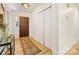 Inviting foyer with hardwood floors, a wooden front door, and a classic rug at 1115 Berry Ridge Rd, Charlotte, NC 28270