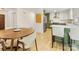 Kitchen and dining area showcasing stylish cabinets, marble counters, and stainless steel appliances at 1115 Berry Ridge Rd, Charlotte, NC 28270