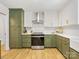 Updated kitchen featuring two-tone cabinets, stainless steel appliances, and designer finishes at 1115 Berry Ridge Rd, Charlotte, NC 28270