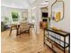 Bright, open-concept living space with modern decor, wood floors, and inviting dining area at 1115 Berry Ridge Rd, Charlotte, NC 28270