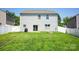 This home features a spacious backyard, white fence and an outdoor firepit at 116 Kingsway Dr, Mooresville, NC 28115