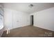 Neutral bedroom with double closets, lots of light and neutral carpet at 116 Kingsway Dr, Mooresville, NC 28115