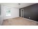 Simple bedroom features lots of light, neutral paint, and closet for storage at 116 Kingsway Dr, Mooresville, NC 28115
