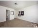Spacious bedroom with neutral carpet, bright paint, and adjacent bathroom at 116 Kingsway Dr, Mooresville, NC 28115