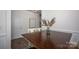 Bright dining room with a dark wood table and room to entertain at 116 Kingsway Dr, Mooresville, NC 28115