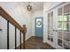 Welcoming entryway features a blue front door and hardwood floors at 116 Kingsway Dr, Mooresville, NC 28115