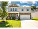 Charming two-story home with stone accents, blue shutters, and attached garage at 116 Kingsway Dr, Mooresville, NC 28115