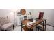 Cozy home office with comfortable seating, vintage typewriter, and computer at 116 Kingsway Dr, Mooresville, NC 28115