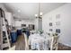 Bright kitchen features white cabinets, stainless steel appliances, and an adjacent breakfast nook at 116 Kingsway Dr, Mooresville, NC 28115