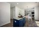 Modern kitchen featuring white cabinets, navy blue island, stainless appliances, and granite counters at 116 Kingsway Dr, Mooresville, NC 28115