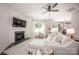 Bright living room with fireplace, large window, and inviting sofa seating at 116 Kingsway Dr, Mooresville, NC 28115
