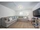 Cozy living room with plush sectional sofa and natural light, perfect for relaxing and entertaining at 116 Kingsway Dr, Mooresville, NC 28115