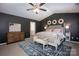 Spacious main bedroom with a decorative rug, furniture, and natural light at 116 Kingsway Dr, Mooresville, NC 28115