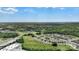 Expansive aerial view showcasing neighborhood surrounded by lush greenery and trees at 135 Orson Oaks Ln, Pineville, NC 28134