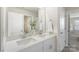 A bright bathroom with double sinks, quartz countertops, and stylish decor at 135 Orson Oaks Ln, Pineville, NC 28134