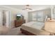 Inviting bedroom featuring a ceiling fan, carpet, and lots of natural light at 135 Orson Oaks Ln, Pineville, NC 28134