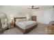 Comfortable bedroom with soft lighting, carpet, and a relaxing atmosphere at 135 Orson Oaks Ln, Pineville, NC 28134