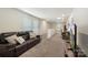 Comfortable bonus room featuring a sofa, carpet, and a TV area for relaxation at 135 Orson Oaks Ln, Pineville, NC 28134