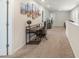 Open loft space with a dedicated desk area, carpet, and ample natural light at 135 Orson Oaks Ln, Pineville, NC 28134