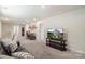 Spacious bonus room with neutral carpet, comfortable seating, and a desk area at 135 Orson Oaks Ln, Pineville, NC 28134