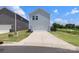 Beautiful exterior of home with a large driveway and well-kept landscaping at 135 Orson Oaks Ln, Pineville, NC 28134