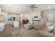 Open floor plan showcases living room, dining area, and kitchen with island seating at 135 Orson Oaks Ln, Pineville, NC 28134