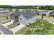 Aerial view of backyard, highlighting well-maintained lawns and neighborhood at 135 Orson Oaks Ln, Pineville, NC 28134