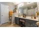 A bathroom vanity featuring double sinks, ample counter space and neutral finishes at 14755 Lions Paw St, Charlotte, NC 28273