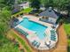 Community pool featuring ample seating, a fenced perimeter, and a pool house, perfect for residents at 14755 Lions Paw St, Charlotte, NC 28273