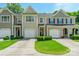 Charming townhome featuring a one-car garage and well-manicured front yard at 14755 Lions Paw St, Charlotte, NC 28273