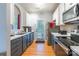 Spacious kitchen features stainless steel appliances, gray cabinets, and a door leading outside at 14755 Lions Paw St, Charlotte, NC 28273