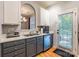 Well-appointed kitchen with stainless steel appliances and gray cabinets at 14755 Lions Paw St, Charlotte, NC 28273