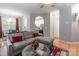 Comfortable living room with a view of the kitchen and dining area, featuring wood floors and neutral walls at 14755 Lions Paw St, Charlotte, NC 28273