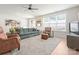 Bright living room with a large window, comfortable seating, and an open layout leading to the dining area at 1517 Falcon St, Charlotte, NC 28211