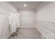 This walk-in closet has custom shelving and ample storage space for organization at 1517 Falcon St, Charlotte, NC 28211