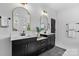 Elegant bathroom with dual vanities, modern fixtures, and a neutral color palette at 18027 Wilbanks Dr, Charlotte, NC 28278