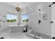 Luxurious bathroom featuring a freestanding tub, a glass-enclosed shower, and high-end fixtures at 18027 Wilbanks Dr, Charlotte, NC 28278