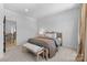 Cozy bedroom featuring neutral tones, soft carpet, and a comfortable bed with stylish bedding at 18027 Wilbanks Dr, Charlotte, NC 28278