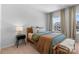 Comfortable bedroom with cozy bed, stylish side table, and a bright, sunny window at 18027 Wilbanks Dr, Charlotte, NC 28278
